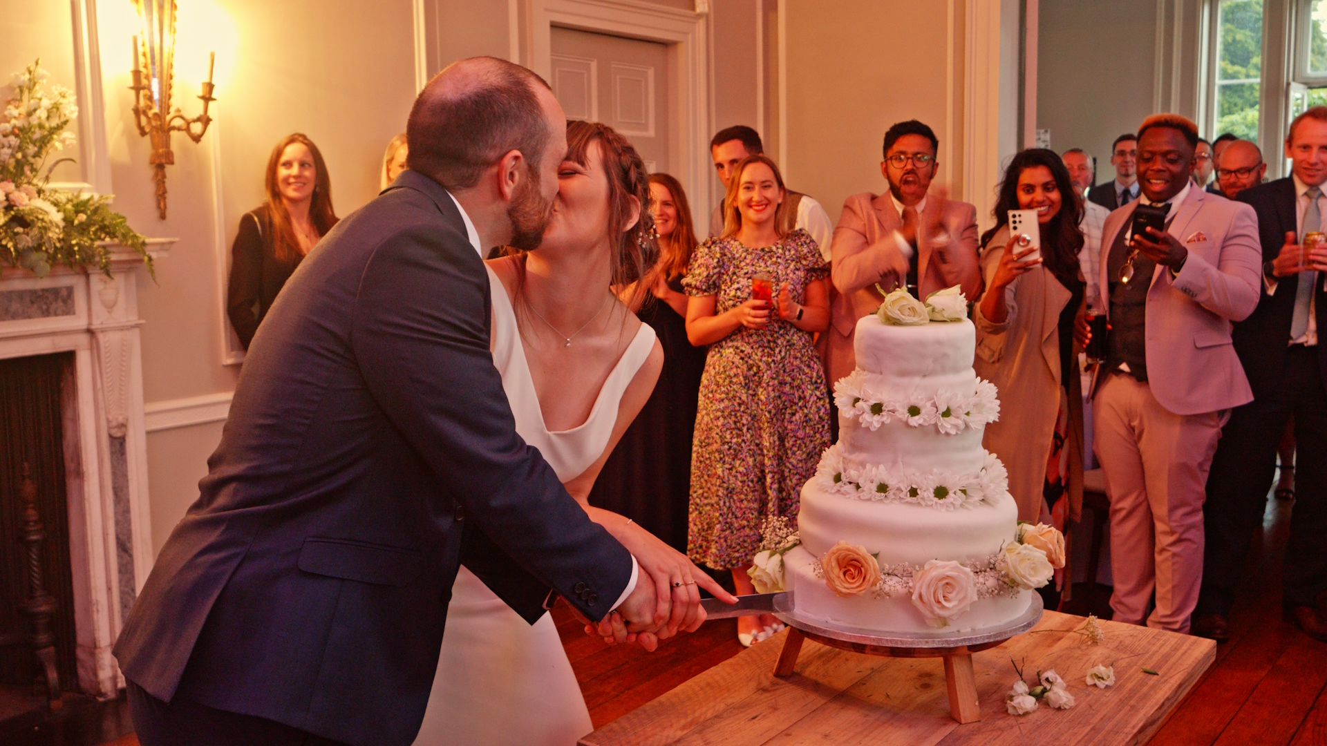 Nicky and Rich cut their wedding cake.