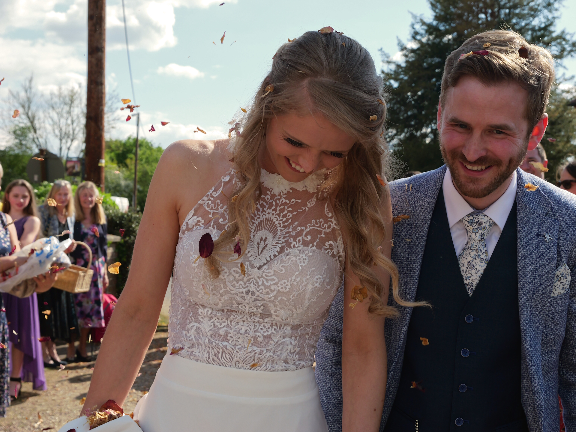 Sophie and Tom leaving the church in a flurry of confetti.