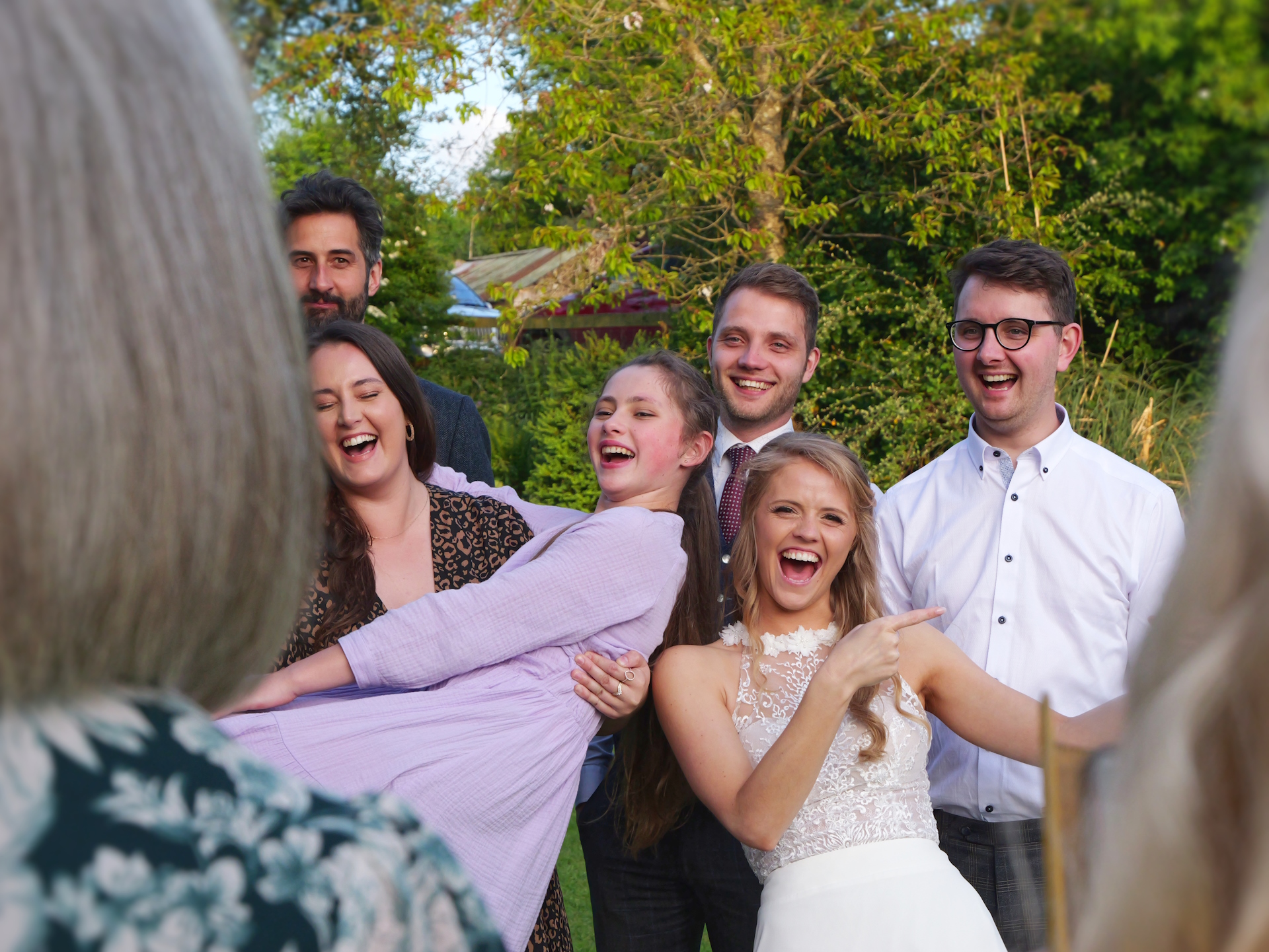 Wedding guests posing for a fun photo.